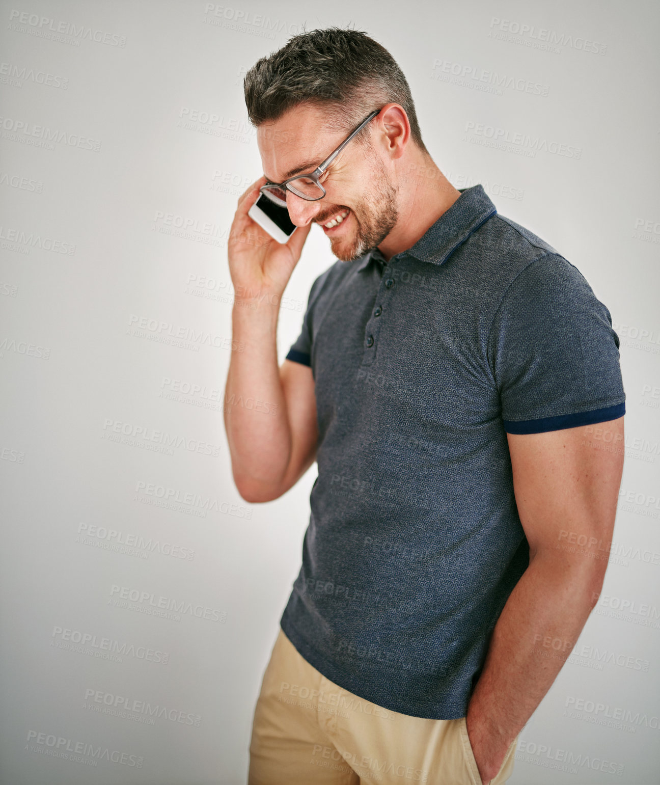 Buy stock photo Phone call, smile and man with conversation, contact and communication on grey studio background. Person, model and guy with a smartphone and discussion with planning and speaking with network or app