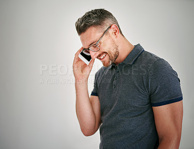 Buy stock photo Phone call, happy and man with conversation, contact and communication on grey studio background. Person, model and guy with cellphone, smile or discussion with planning and speak with network or app