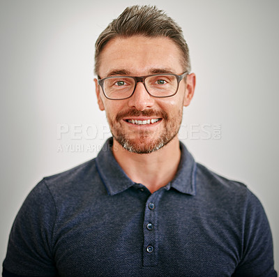 Buy stock photo Man, portrait and smile in studio, designer and employee with pride, confidence and grey background. Creative, staff and male person, happiness and startup of business, worker and entrepreneur in job