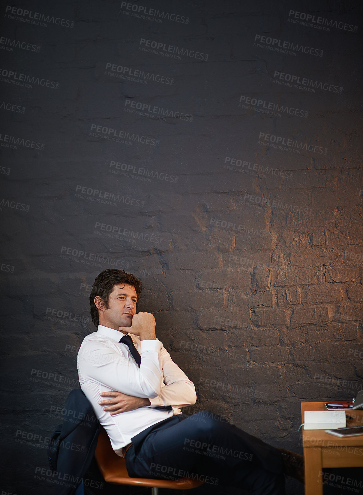 Buy stock photo Man, thinking and planning in office at night for business opportunity, startup and company strategy. Entrepreneur, vision and idea in workplace for corporate growth, ambition and goals by wall
