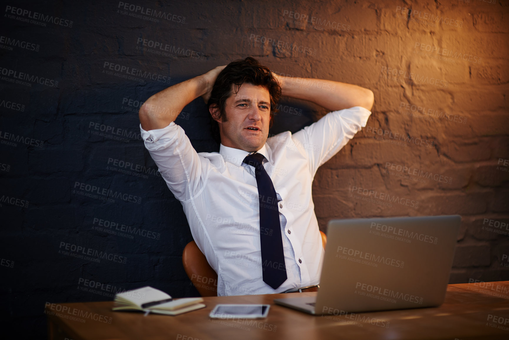 Buy stock photo Relax, businessman and stretching at desk with laptop for reading, online and research for career. Internet, technology and male person in office at night with idea, computer and brick wall or email