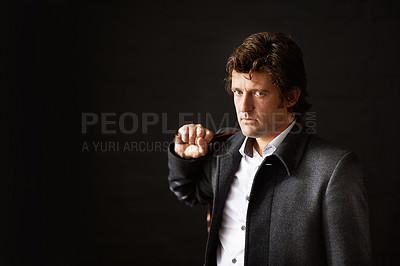 Buy stock photo Portrait, businessman and dark in studio with bag, mystery and confidence on black background. Male boss, edgy and leadership with satchel for business, determination and aesthetic with copyspace