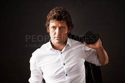 Buy stock photo Businessman, serious and jacket on shoulder in studio with confidence as detective of power, ambition and mystery. Pensive, male person and officer, pride and crime investigation on black background