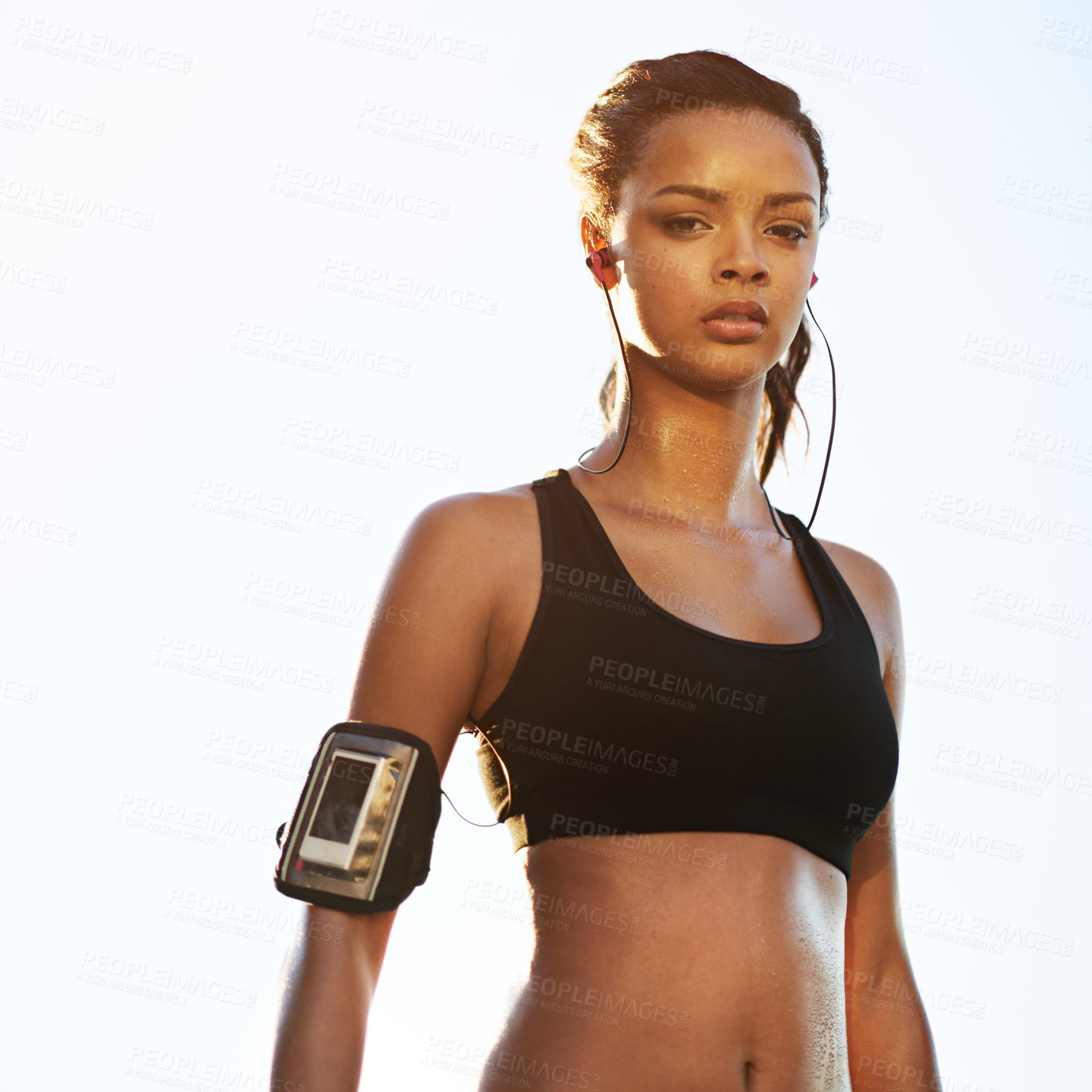 Buy stock photo Shot of a young woman taking a break from her workout