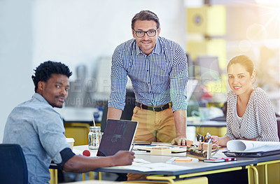 Buy stock photo Portrait of a group of people working at their desks in an office