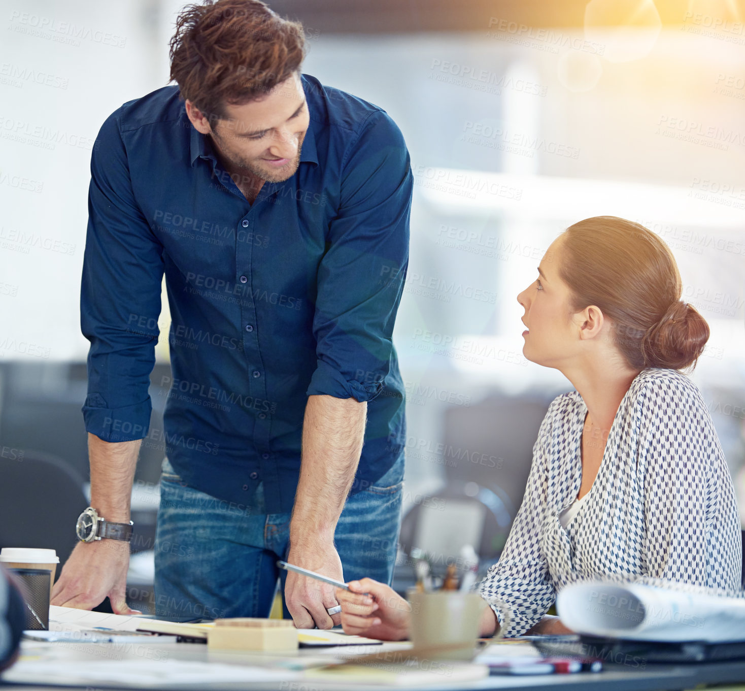 Buy stock photo Shot of two coworkers talking together in an office