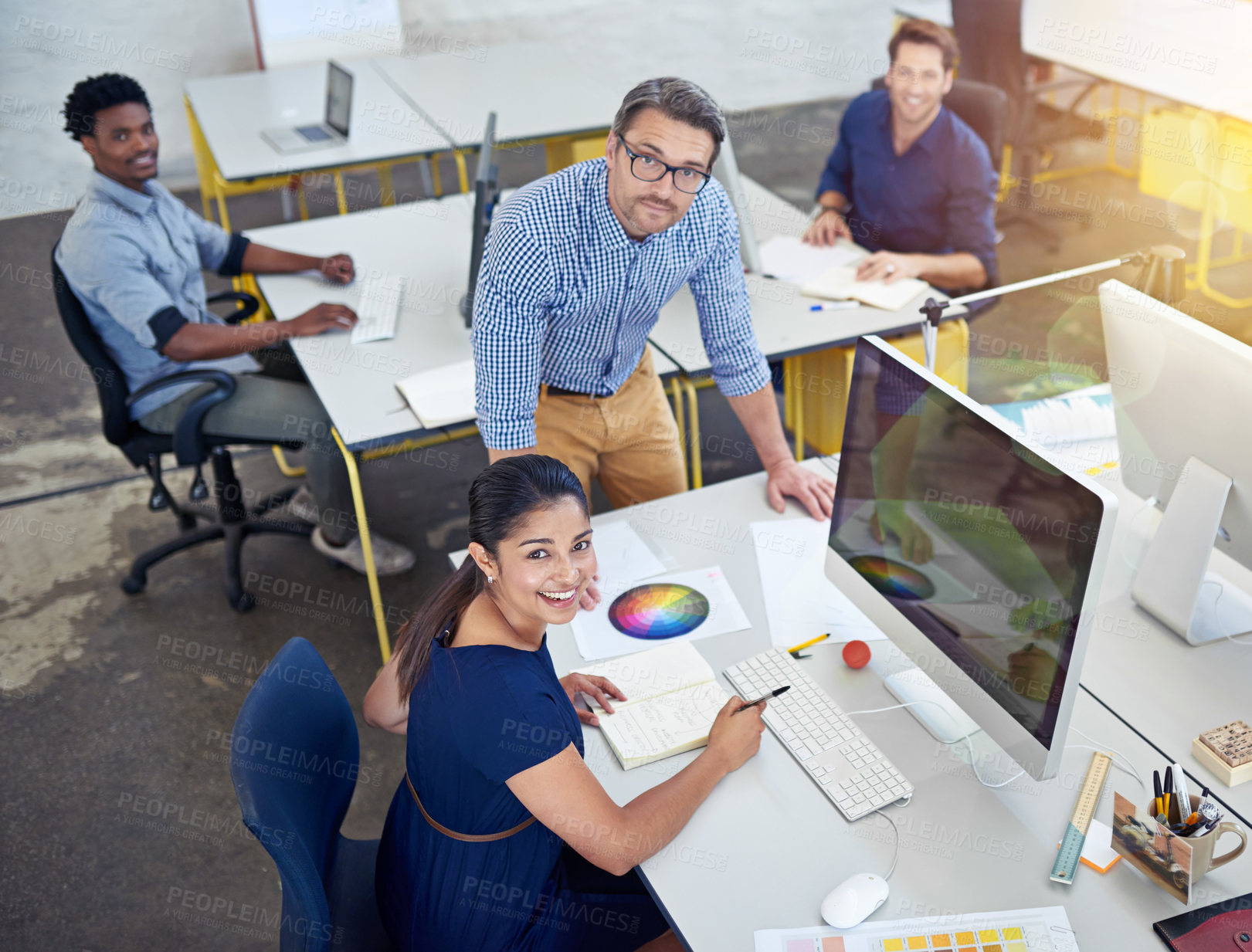 Buy stock photo Above, office and employees with smile for teamwork or collaboration and coworking with strategy. Business, people and happy as graphic designers on computer with pride for creative ideas and plan