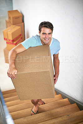 Buy stock photo Man, portrait and boxes in new house by stairs with smile, fresh start and investment in real estate. Person, cardboard and package on steps in apartment, home and happy for rent, moving or property