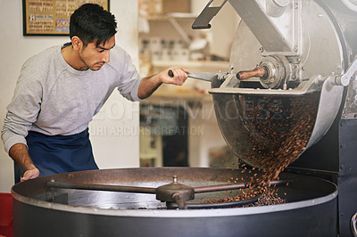 Buy stock photo Coffee shop, small business and man at machine for roasting with blending, production or quality control. Entrepreneur, barista or roaster with beans at cafe, sustainable startup and espresso process