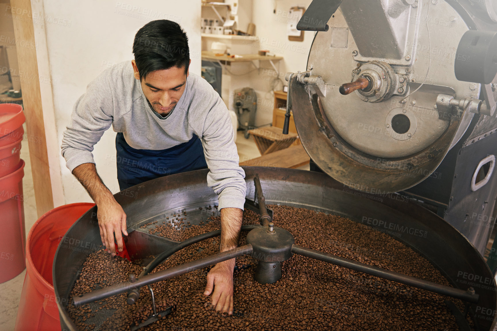 Buy stock photo Coffee, cafe and man with machine for roasting with blending, production and quality control. Entrepreneur, barista or person with beans at small business, sustainable startup and espresso process