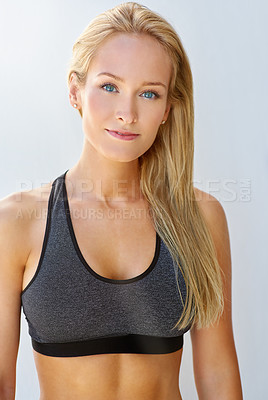 Buy stock photo Cropped portrait of a sporty young woman standing outside