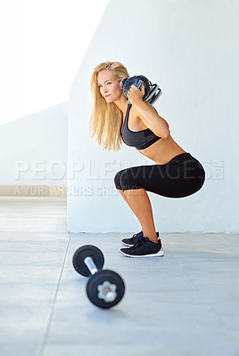 Buy stock photo Shot of a young woman working out with a bulgarian bag