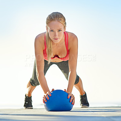 Buy stock photo Fitness, woman and outdoor with medicine ball for push up, workout and muscle development in portrait. Athlete, gym equipment and serious in training with core exercise, balance or wellness challenge