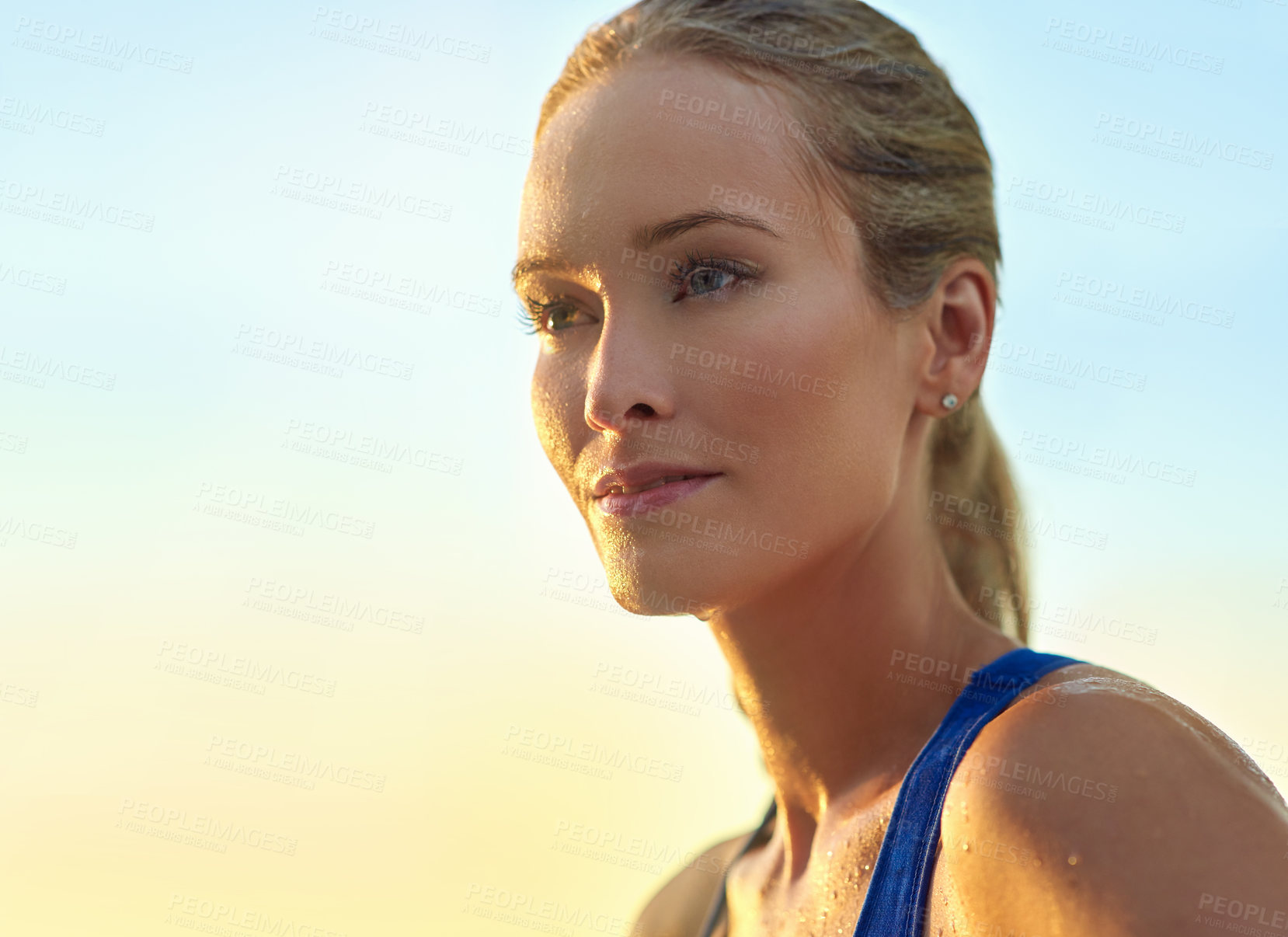 Buy stock photo Cropped shot of a sporty young woman standing outdoors