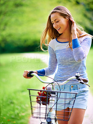 Buy stock photo Happy woman, walking or bicycle in park for flowers, wellness or health on holiday vacation in nature. Outdoor break, travel or female person cycling to relax with smile, transport or basket on path