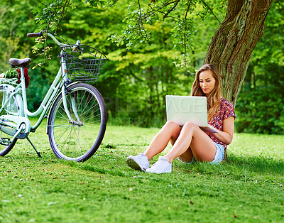 Buy stock photo Laptop, bicycle and girl on grass in park with website, research and online education with internet. Studying, relax and woman with bike, computer and checking course for elearning on field in nature