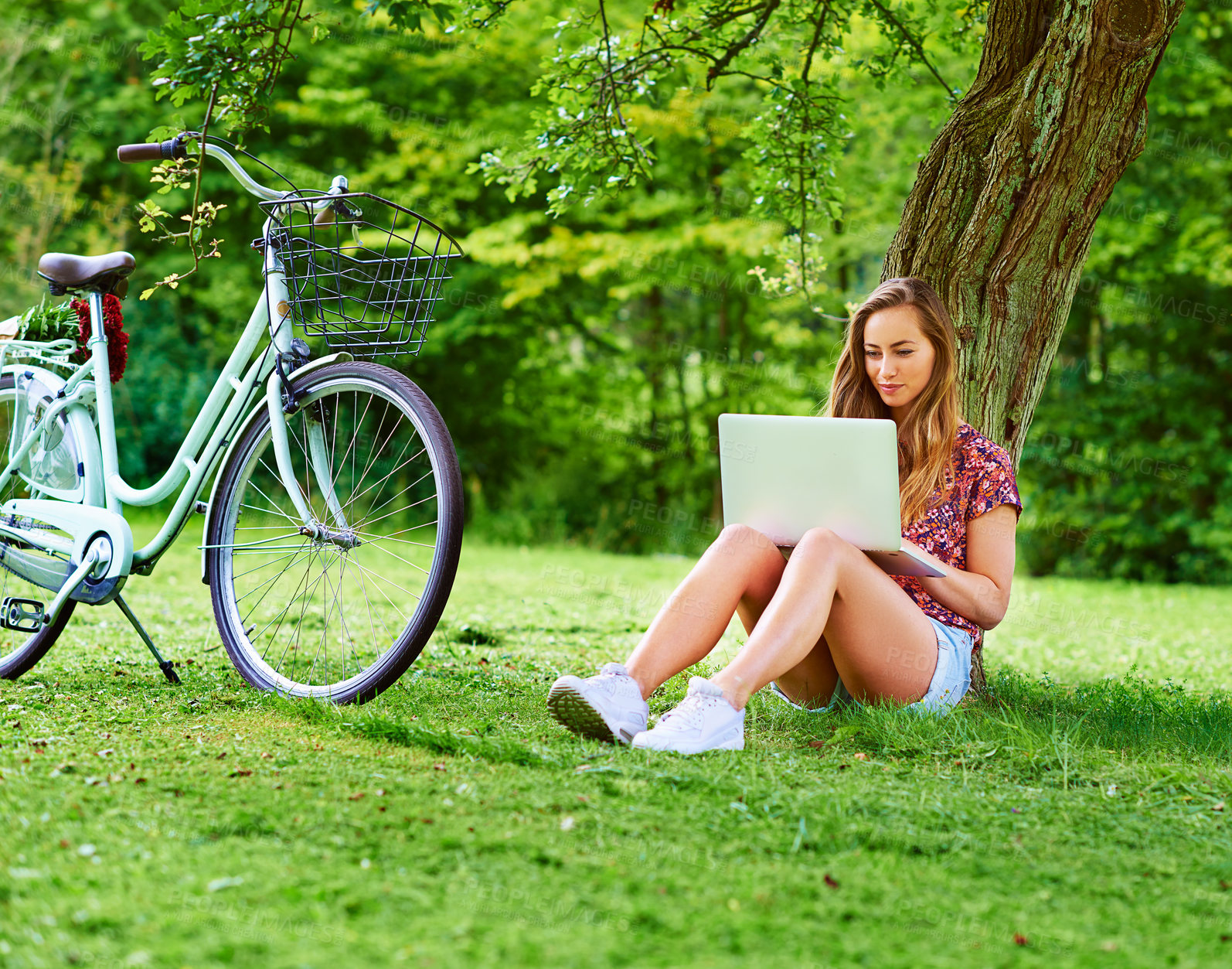 Buy stock photo Laptop, bicycle and girl on grass in park with website, research and online education with internet. Studying, relax and woman with bike, computer and checking course for elearning on field in nature