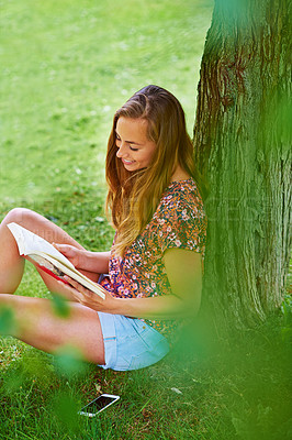 Buy stock photo Woman, nature and outdoor with reading book for learning, education and happiness in park or backyard. Female person, novel and travel in countryside for rest, relax and zen as student on holiday