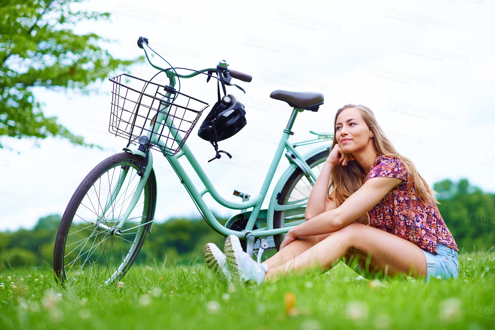 Buy stock photo Woman, outdoor and bicycle with thinking on vacation, holiday and happiness in park or nature. Female person, grass and travel in countryside for rest, relax and break as student on adventure in town