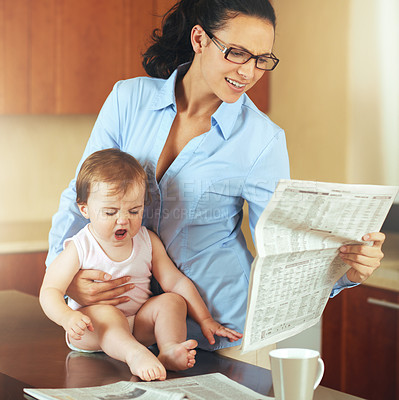 Buy stock photo Woman, mom and baby with tantrum in home while reading, newspaper and multitasking for remote job. Single mother, toddler or little girl with upset face by growth, milestone or development in kitchen