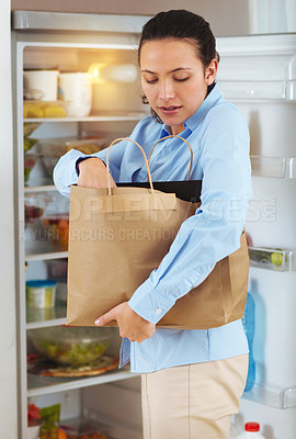 Buy stock photo Woman, groceries and bag for packing in fridge with idea for organization of food, fruit or vegetables for diet. Female person, think and meal for nutrition, vegan and recipe with produce in home