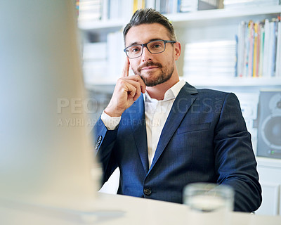 Buy stock photo Portrait, confidence and business man at desk in office on computer for career or job in Germany. Face, professional and salesman in glasses, entrepreneur or corporate employee in suit at workplace