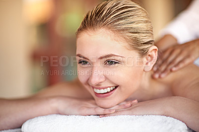 Buy stock photo Shot of a young woman enjoying a massage at the spa