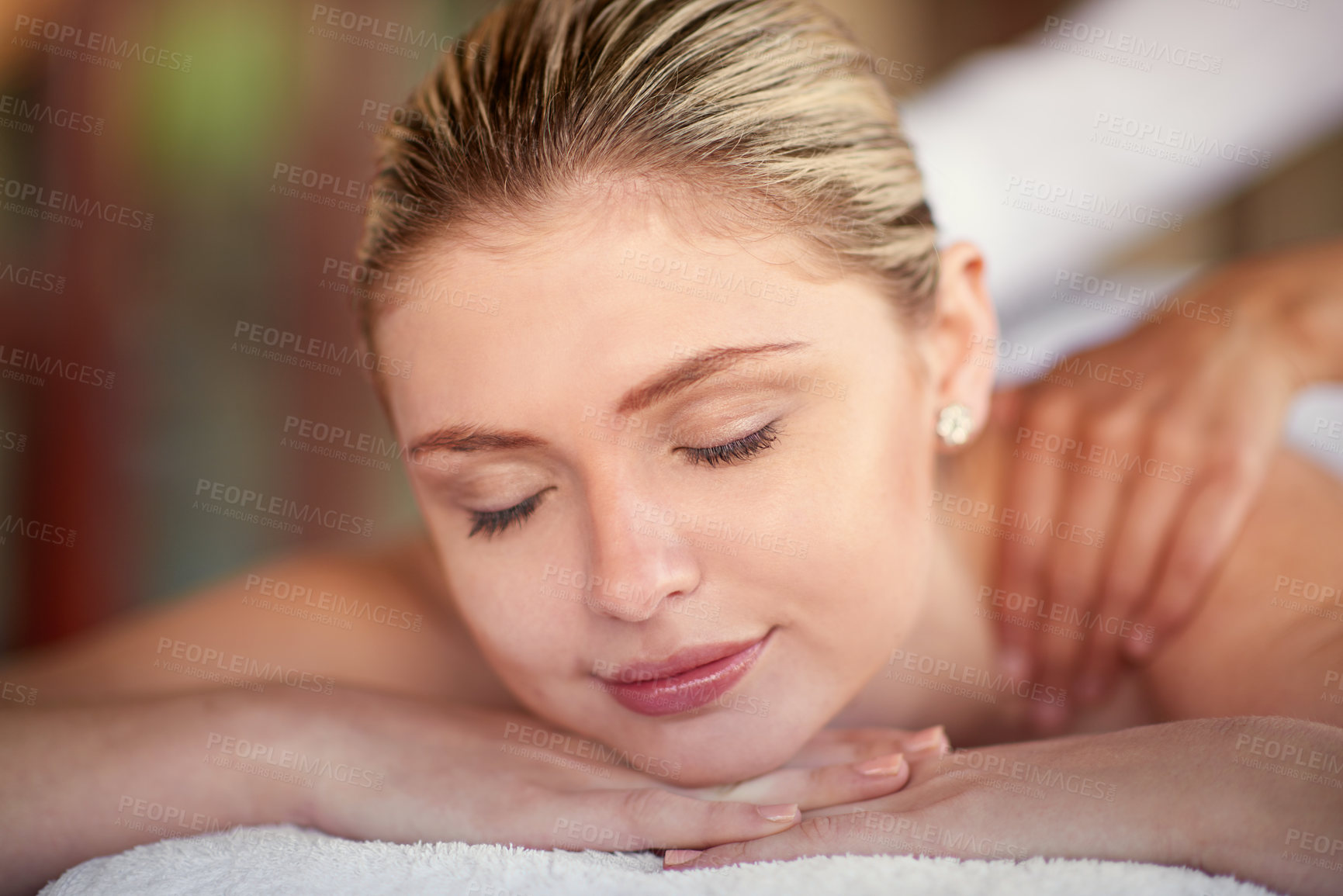 Buy stock photo Girl, calm and relax for massage by spa or pampering, self care and beauty or body treatment with stress relief. Woman, eyes closed and bed for peace, satisfaction and wellbeing with skincare or zen.