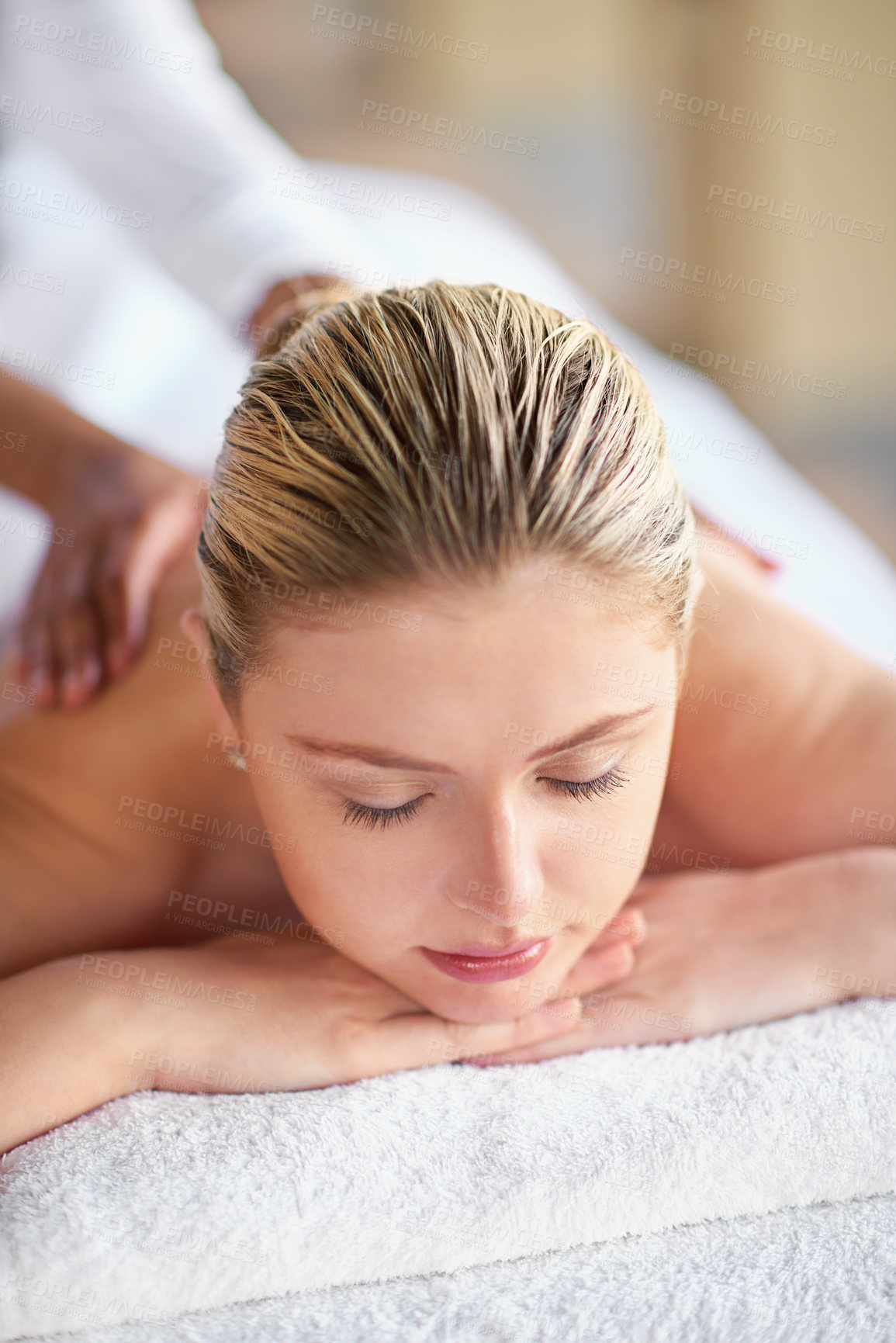 Buy stock photo Girl, eyes closed and calm for massage by spa or pampering, self care and beauty or body treatment with stress relief. Woman, relax and bed for peace, satisfaction and wellbeing with skincare or zen.