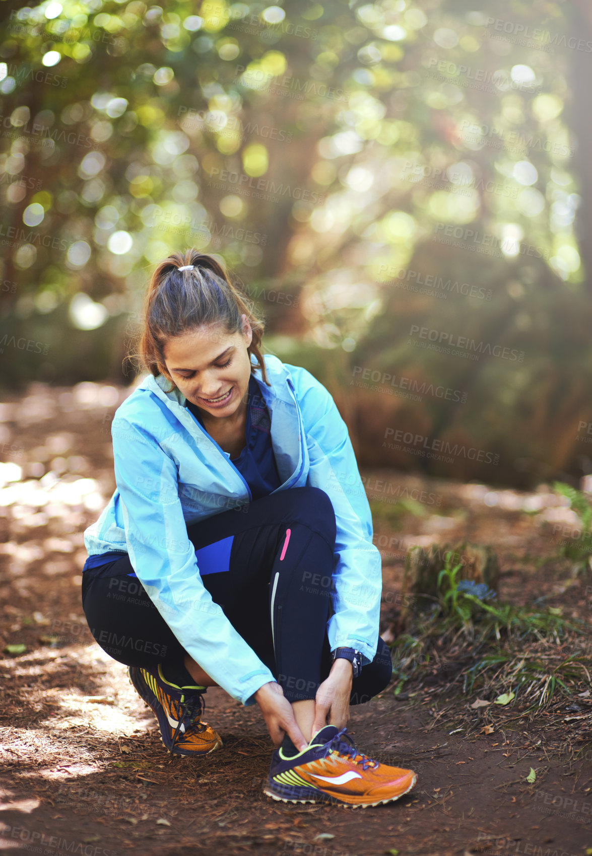Buy stock photo Woman, runner and ankle injury in nature, forest and stop training to massage joint pain on path. Girl, person and accident in workout for fitness, health and thinking in woods for hiking in morning