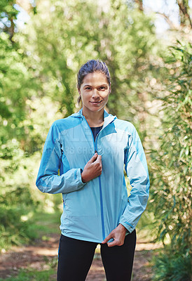 Buy stock photo Portrait of a young woman out for a trail run