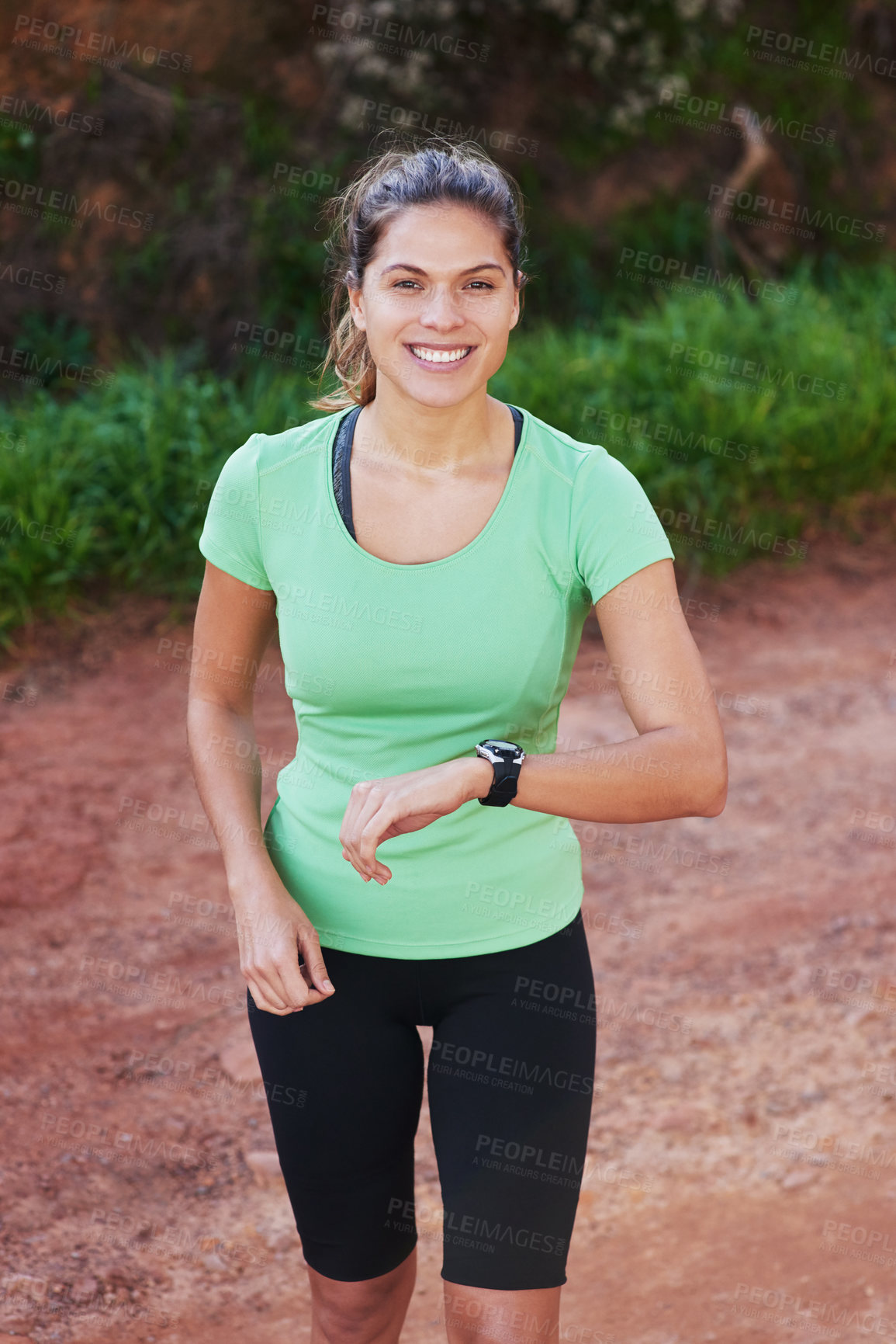 Buy stock photo Shot of a young woman out for a trail run