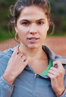Buy stock photo Shot of a young woman out for a trail run