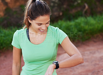 Buy stock photo Woman, training and check smart watch in nature for workout goals, running and cardio results. Sports person or runner check timer or stopwatch for exercise, fitness and health progress in forest
