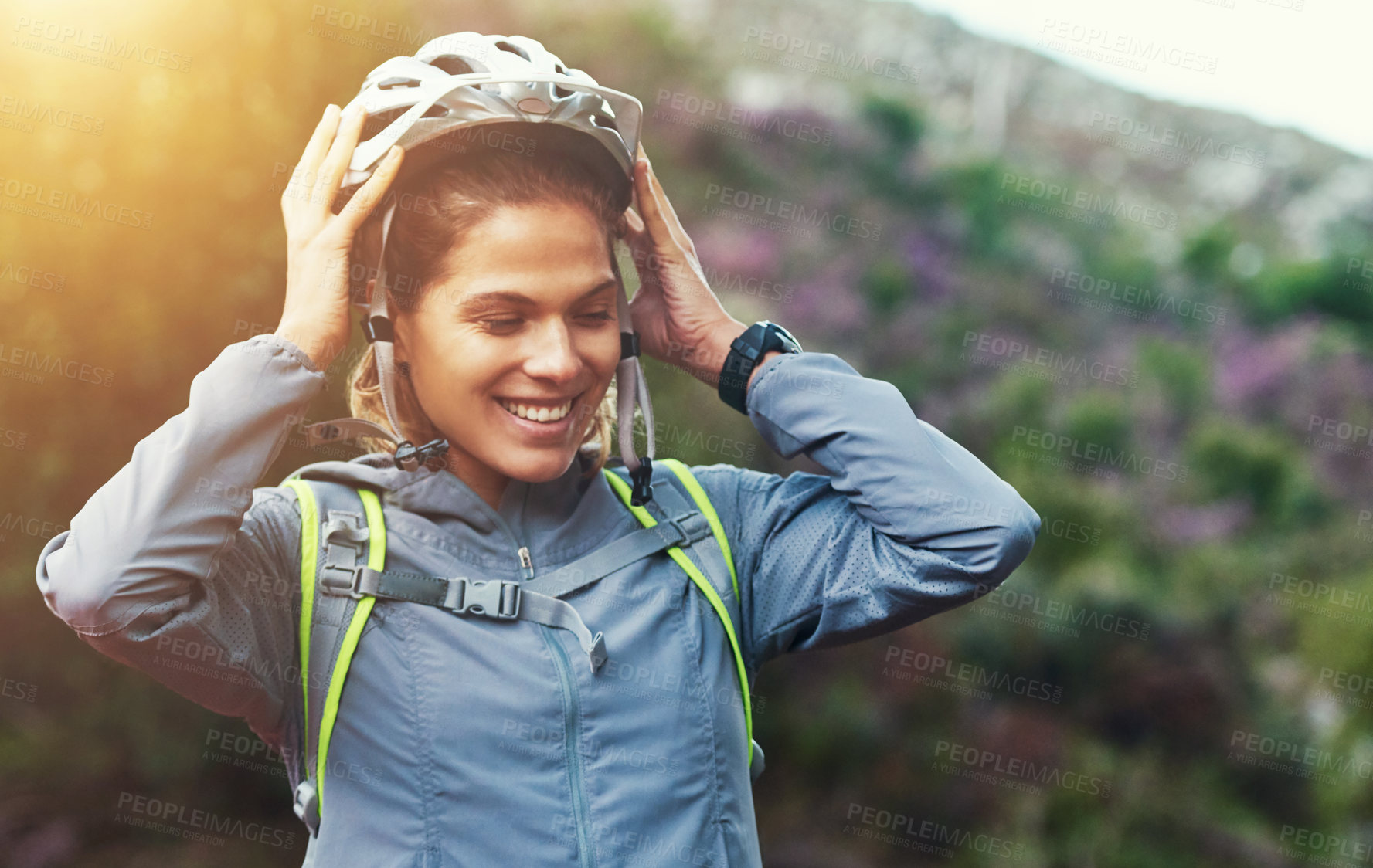 Buy stock photo Shot of a female mountain biker out for an early morning ride