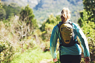 Buy stock photo Back, walking and woman hiking on trail in nature on outdoor adventure to explore on holiday vacation. Girl, runner and hiker trekking in woods for training, wellness or travel journey for fitness