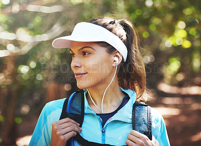 Buy stock photo Earphones, music and woman hiking in nature on outdoor adventure to explore on holiday vacation. Sightseeing, relax and hiker trekking in woods for training or travel for streaming podcast playlist