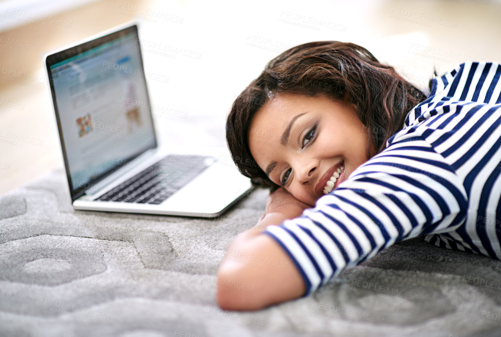 Buy stock photo Portrait of girl, laptop screen and lying on floor carpet at home for movie break, relax and rest with smile. Technology, connectivity and computer watch, online videos and female person in house