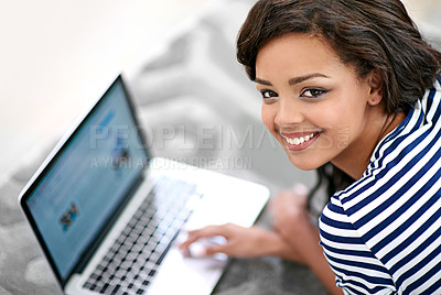 Buy stock photo Portrait of girl, computer screen and lying on floor carpet at home for browsing, relax and rest with smile. Technology, connectivity and laptop for movie, online videos and female person in house