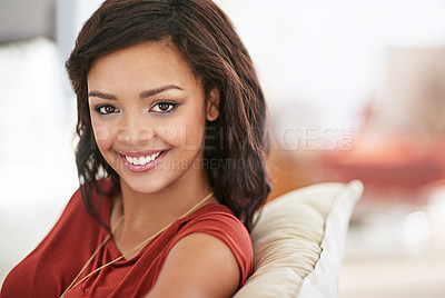 Buy stock photo Woman, smile and relax on sofa for portrait in living room on holiday with confidence, pride and break on weekend. Girl, happy and sitting on couch in lounge for break at apartment in Colombia