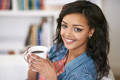 Buy stock photo Portrait of a young woman drinking a cup of coffee at home