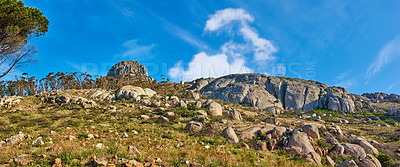 Buy stock photo Field, blue sky and landscape with mountain in nature for ecology, travel and growth. Habitat conservation, ecosystem preservation and biodiversity with sustainability and environment for ecotourism