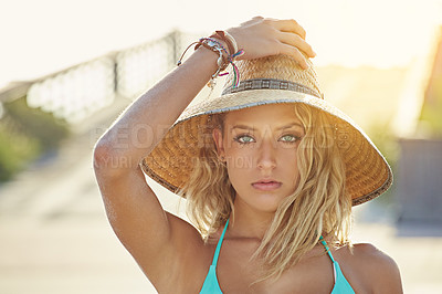 Buy stock photo Shot of a young woman standing outdoors in her bikini