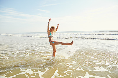 Buy stock photo Shot of an attractive young woman on the beach