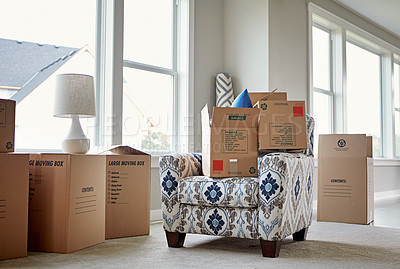 Buy stock photo Shot of packed cardboard boxes and furniture on moving day