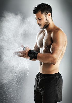 Buy stock photo Man, studio and dusting for chalk, fitness and prepare for workout or fight training. Athlete, body and muscle for power, exercise and sport for boxing health and wellness isolated on grey background