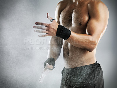 Buy stock photo Bodybuilder, hands and chalk in studio for exercise, weightlifting and fitness or gymnastics. Male gymnast, powder and preparation for workout, training or muscular on black background with arm bands
