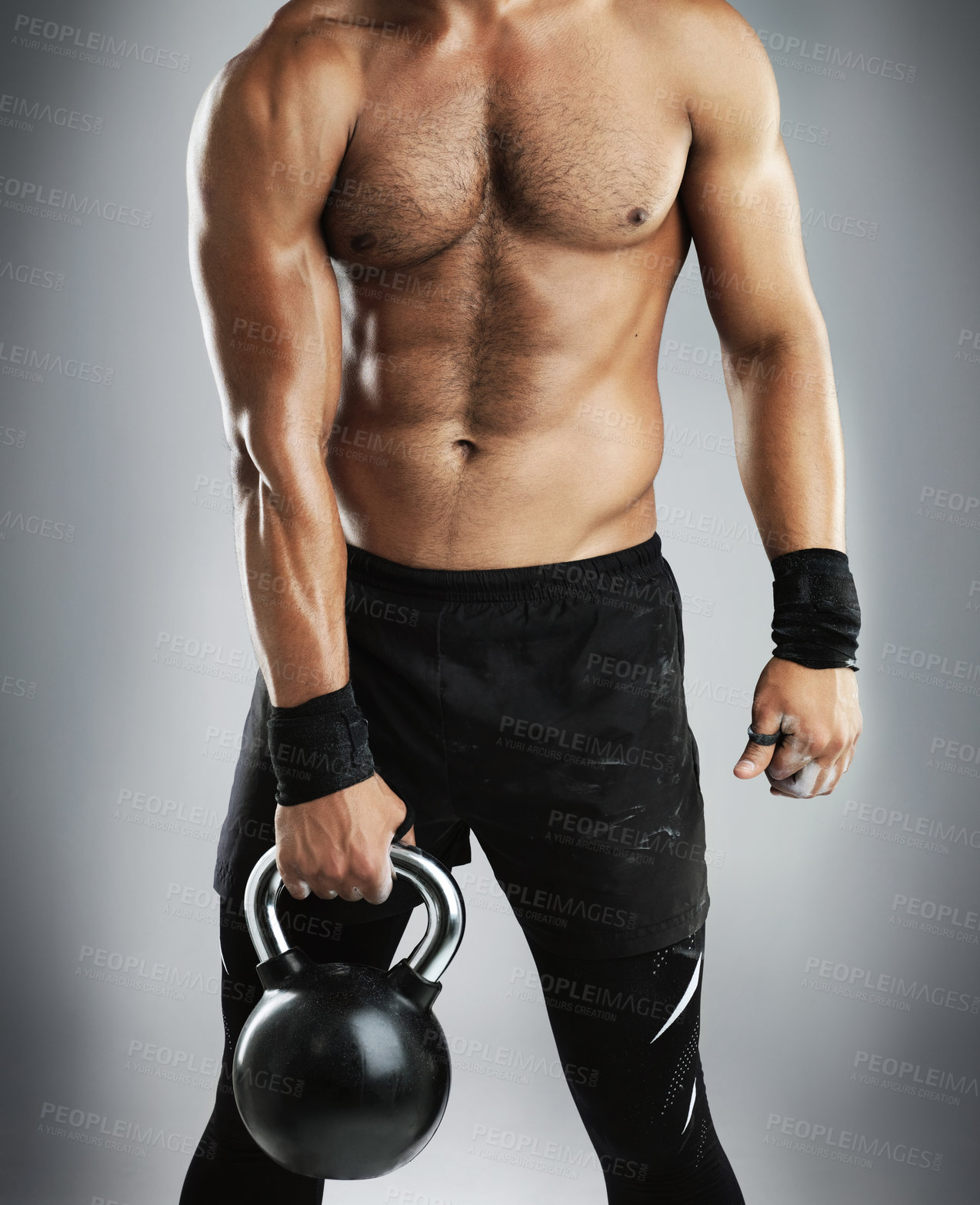 Buy stock photo Fitness, man and hand on kettlebell as bodybuilder in studio for workout, training and exercise for strong muscle. Athlete, person and weightlifting with body power for health on grey background