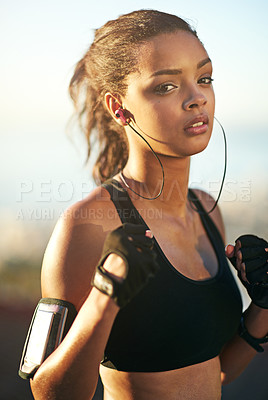 Buy stock photo Woman, portrait and outdoor exercise as boxer with fists or earphones or cellphone arm strap, fitness app or fighter. Female person, face and music listening for outside cardio, nature or training