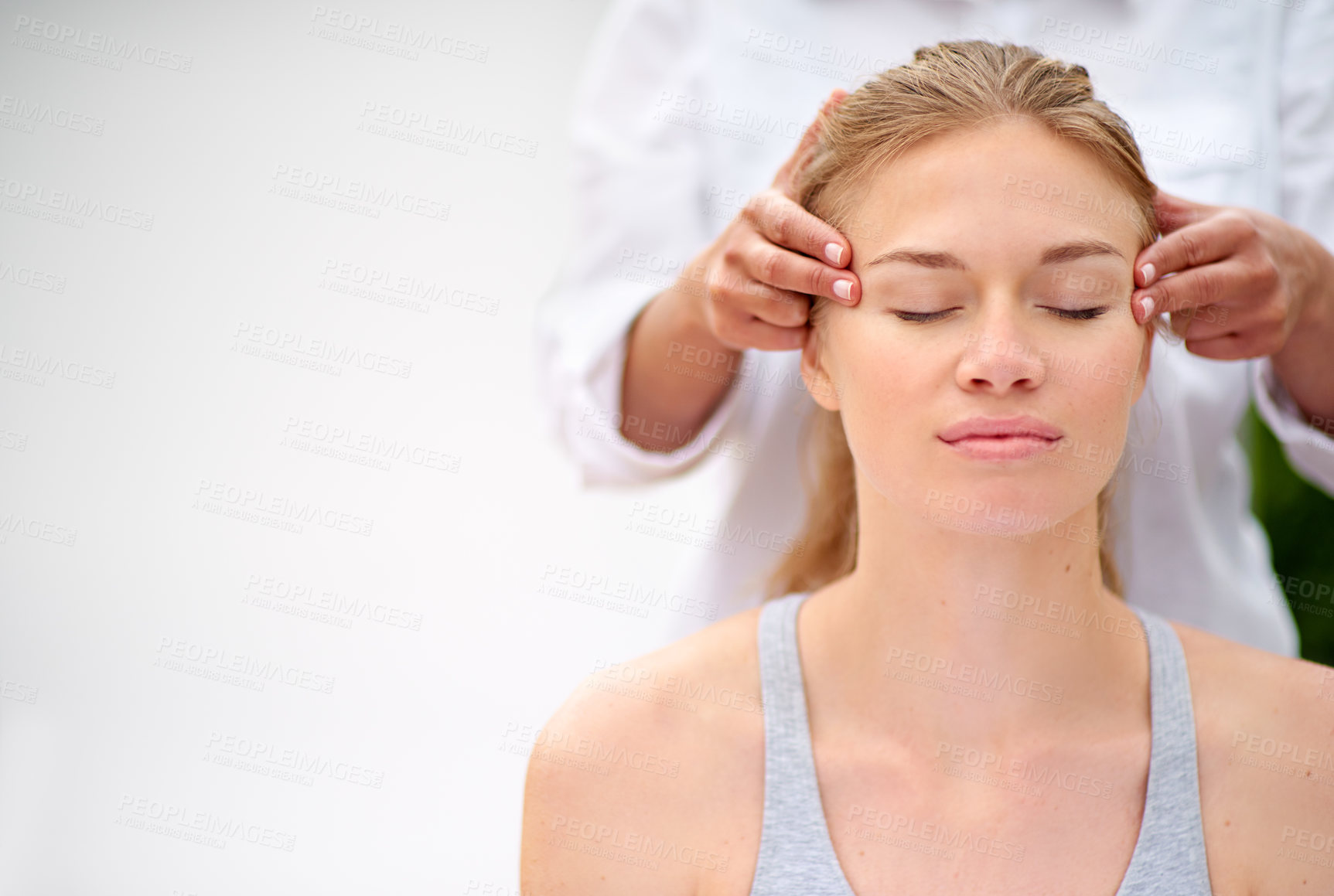 Buy stock photo Cropped shot of a young woman enjyoing a massage at the day spa